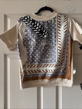 HERMES with no tags 
Cream & Gray Printed Scarf-Style Blouse